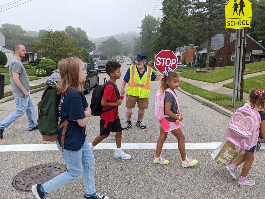photo of crossing guard and students